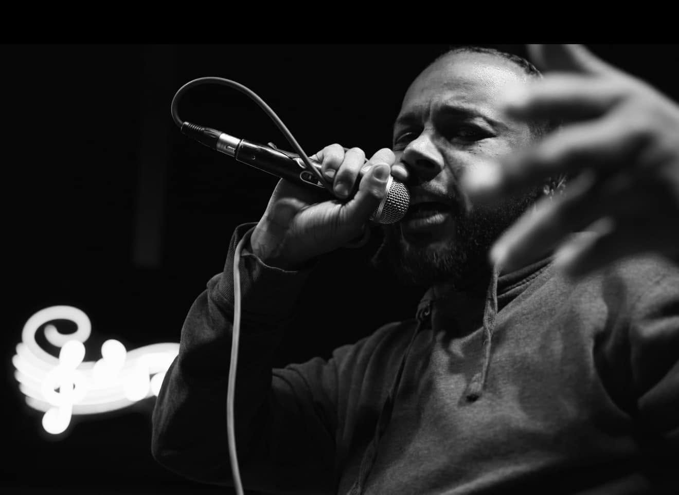 KHANFIDENCE performing live at the microphone